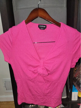 Bebe pink shirt with rose detail size medium